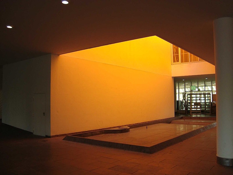 a room bathed in yellow light from an unseen light source from above