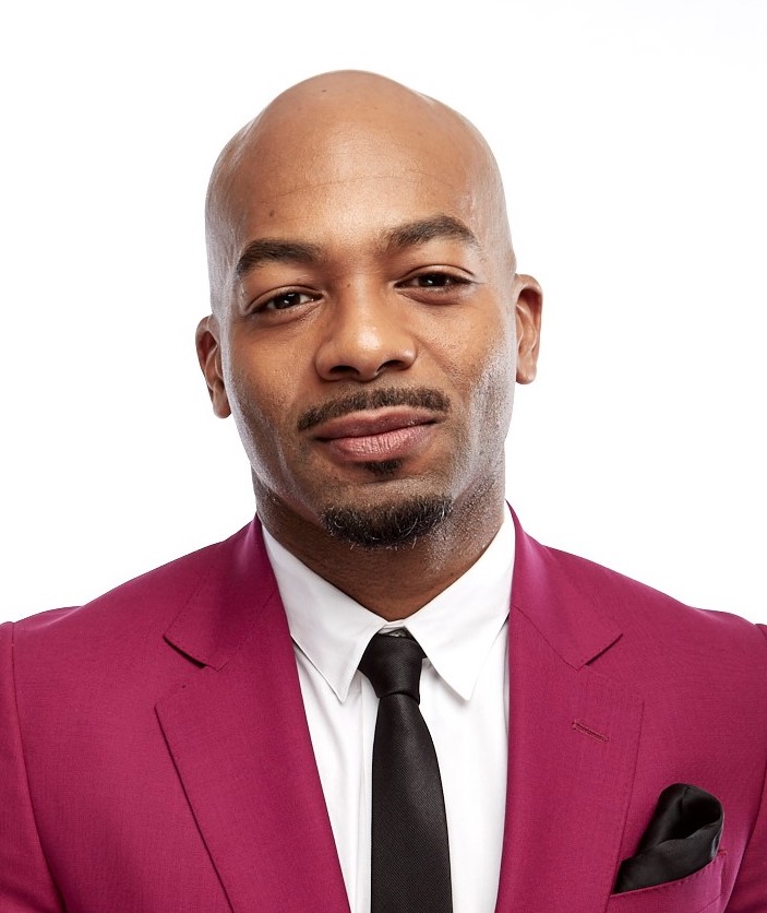 Headshot of a man in suit.