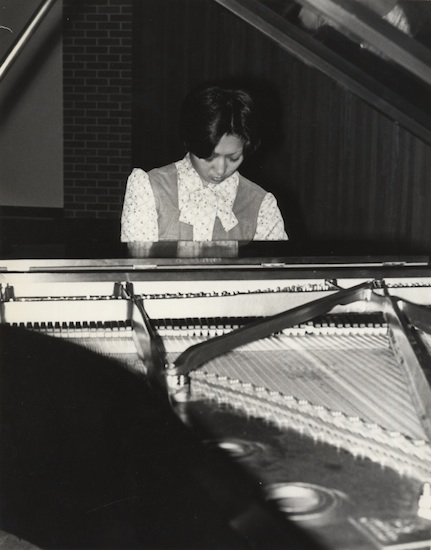 Jane Chu playing the piano as a young woman