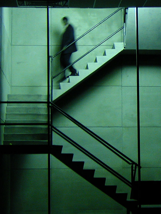 Man walking down staircase on a stage