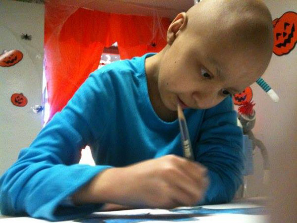 A pediatric oncology patient painting