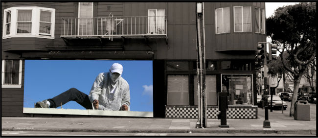 A digital mural of a man scaling a fence