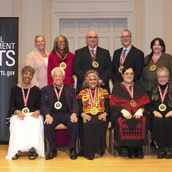 imagefile	caption	altag 2018 NEA National Heritage Fellowships Awards Ceremony and Dinner  2018 NEA National Heritage Fellowships Awards Ceremony and Dinner at the Library of Congress on September 26, 2018. Photos by Tom Pich2018 NEA National Heritage Fel