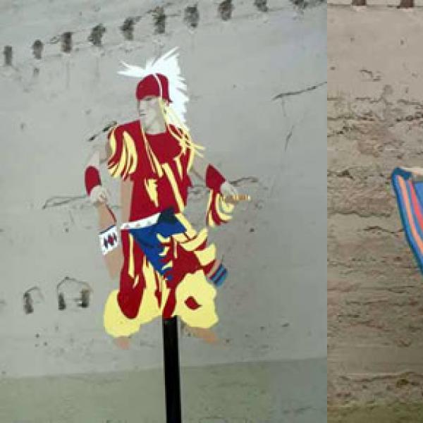 Two of the five metal cutout dancers -- a Yakama fancy dancer and a Mexican dancer -- displayed in a Wapato park