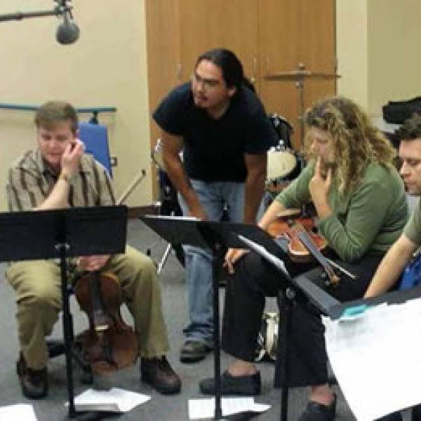 Michael Begay (second from left) working with the ETHEL String Quartet as part of the NACAP activities to bring musical education to Native-American communities. Photo courtesy of NACAP
