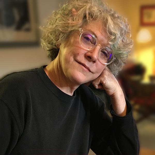 Portrait of a woman wearing glasses.