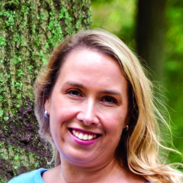 Woman with blond hair smiling