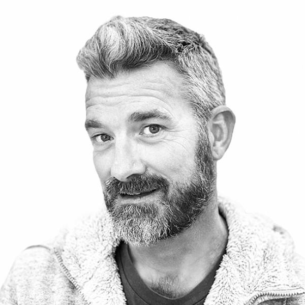 Black and white headshot of a young man 