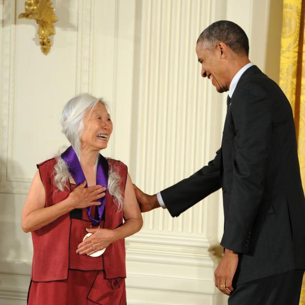 Maxine Hong Kingston receiving an award from Barack Obama