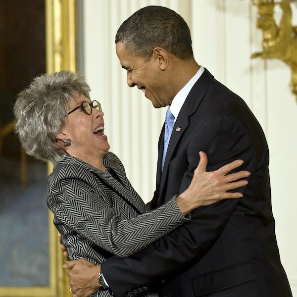2009 National Medal of Arts recipient and singer/dancer/actress Rita Moreno receives her medal from President Barack Obama