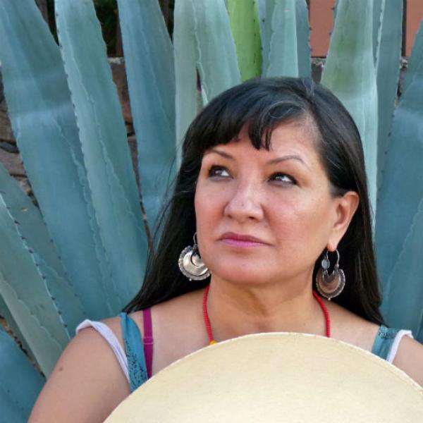 Woman standing in front of cactus