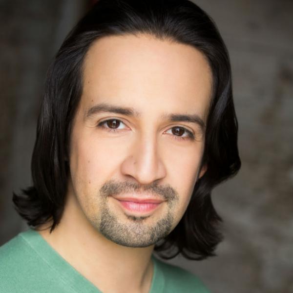 Headshot of a man with dark hair