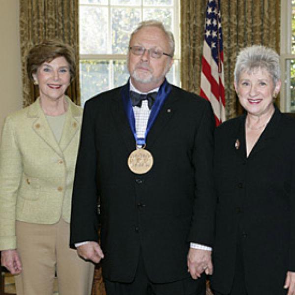President Bush and Laura Bush with William Bolcolm and Joan Morris in the Oval Office