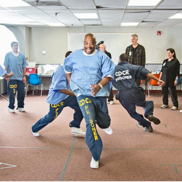 Prisoners running in circles as a theater exercise. 