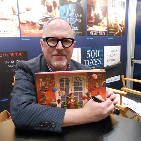 Man holding a book. 