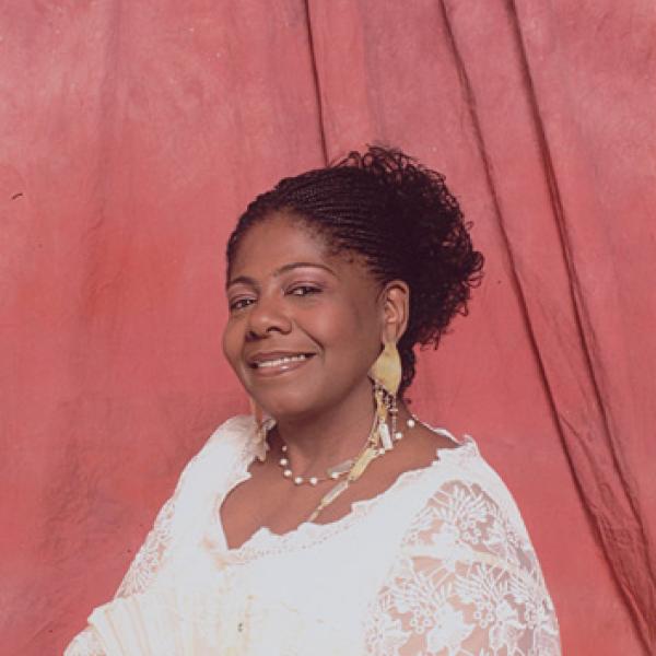 Portrait of woman in white dress.