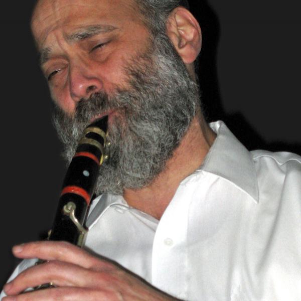 A man plays a saxophone.