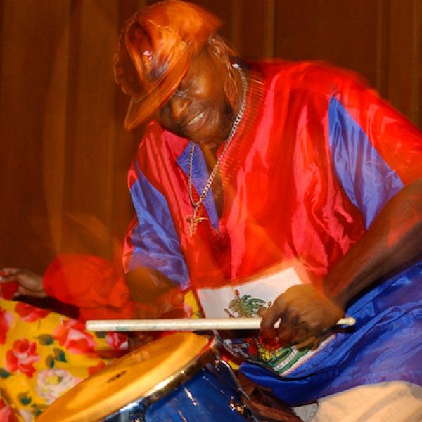 A man playing a large drum.