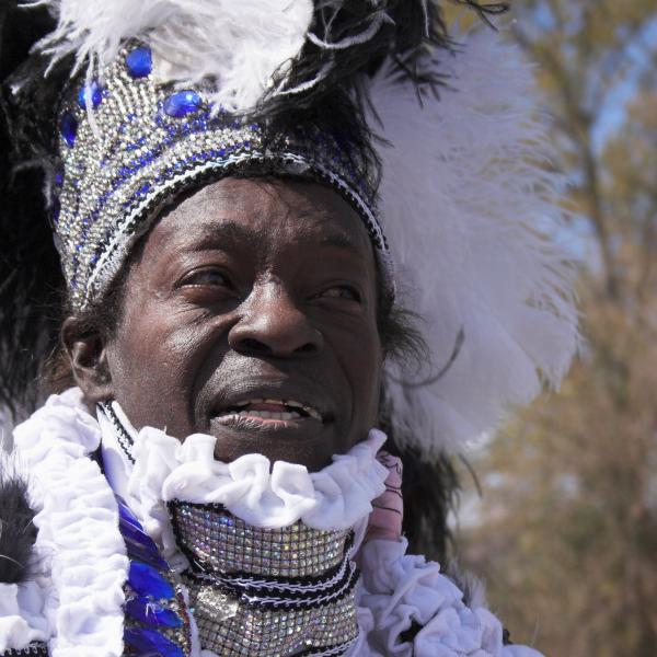Man in Mardi Gras costume.