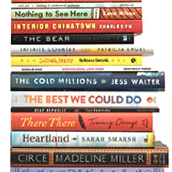 Photo of 15 books that are a part of the 2022-2023 NEA Big Read stacked on top of each other
