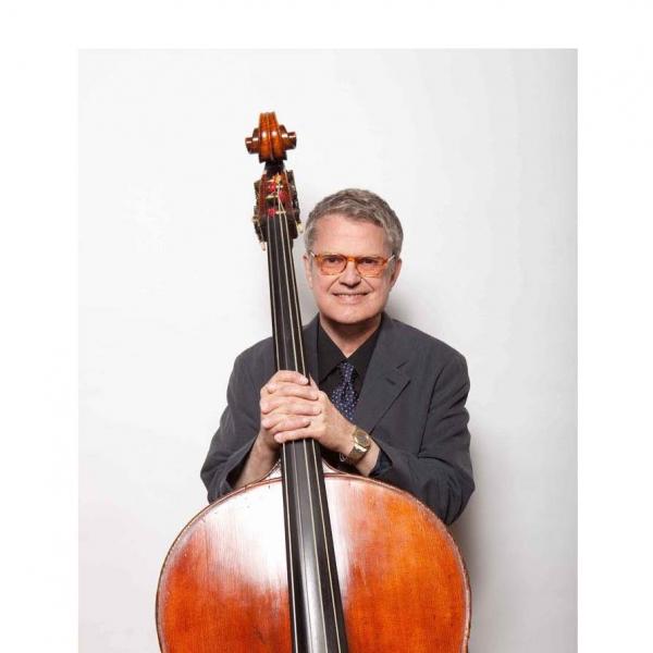 Man holding bass. 