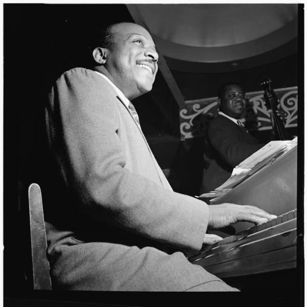 Man playing piano on stage. 