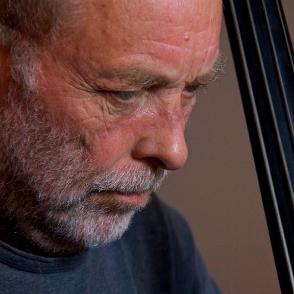 Man holding bass. 
