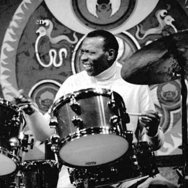 Man playing drums.