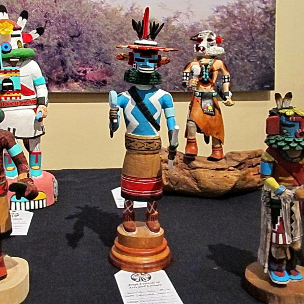 A display of colorful carved katsina dolls made by Hopi artists