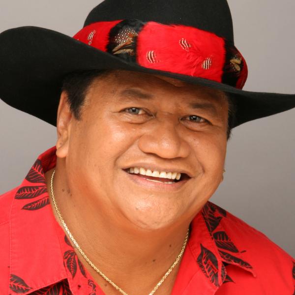 Portrait of man in black and red hat. 