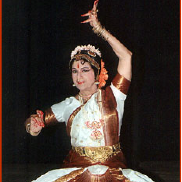 Woman in ethnic garb dancing.