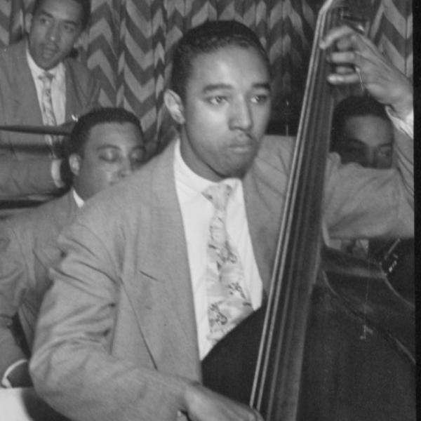 Man playing bass in a jazz orchestra. 
