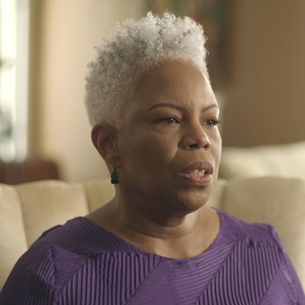 Regina Carter sitting in her home speaking to the interviewer