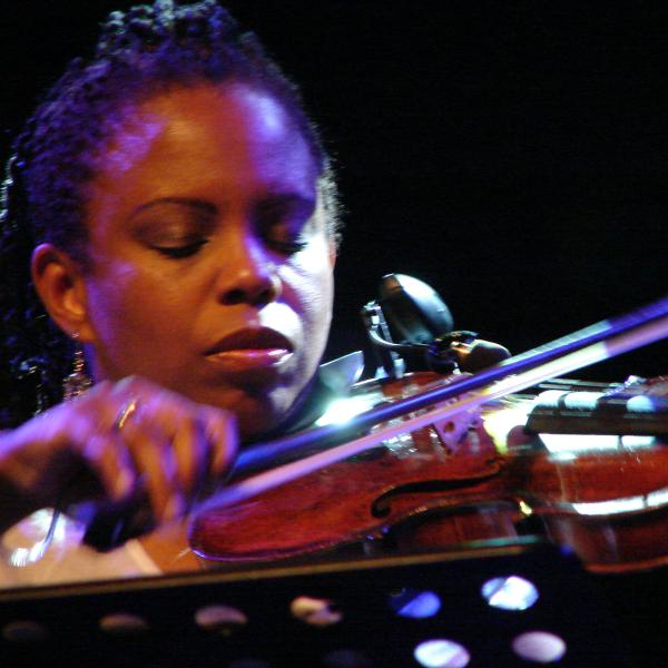 A woman playing a violin.