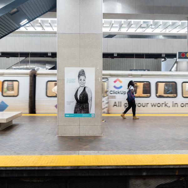 View of a portrait from MARTA's Artbound program on display in a MARTA station