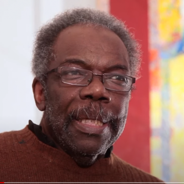 Black man with glasses.