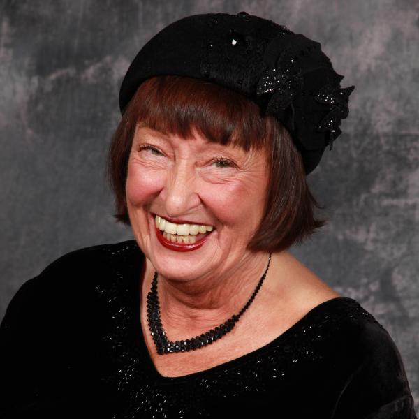 Portrait of woman in black hat. 