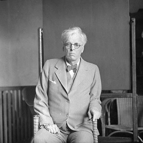 WB Yeats sitting in an office