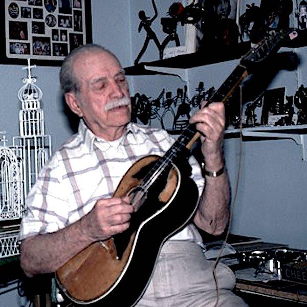 A man playing a guitar.