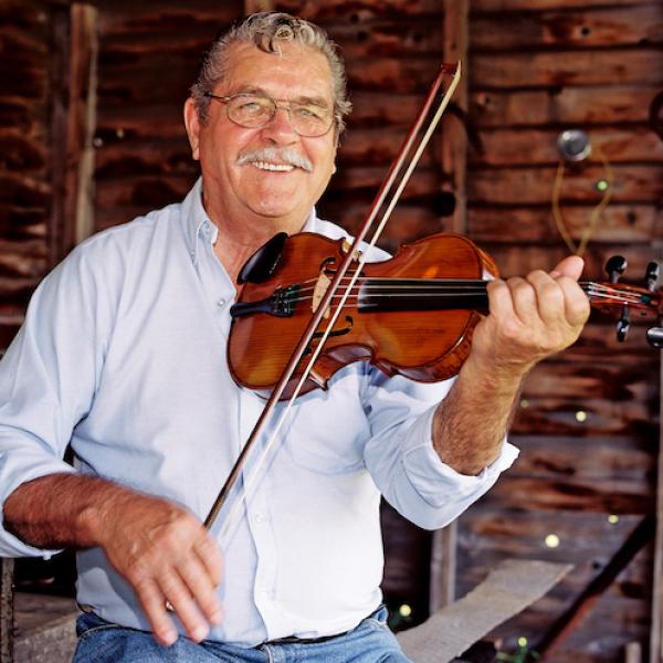 Man playing a fiddle.