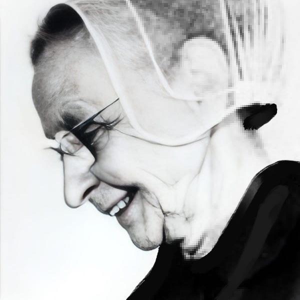 Headshot of a woman with a veil.