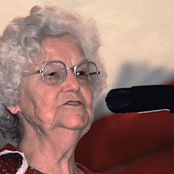 A woman singing into a microphone.