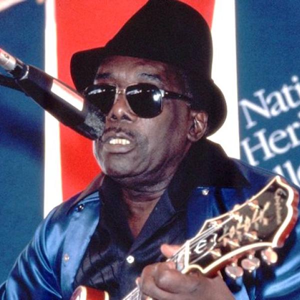 A man playing a guitar.