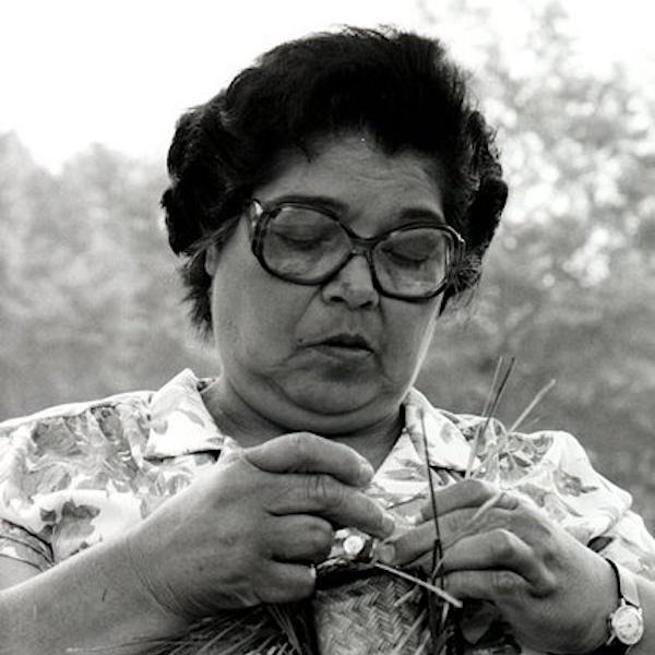 A woman making a basket.