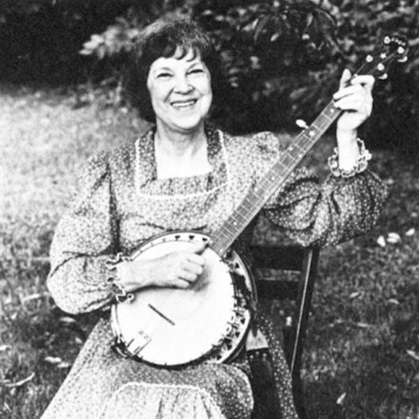 A woman playing the banjo.