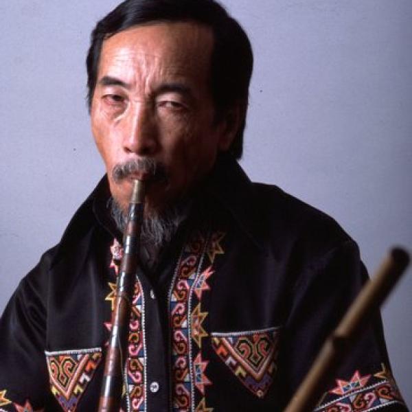 A man playing a flute.