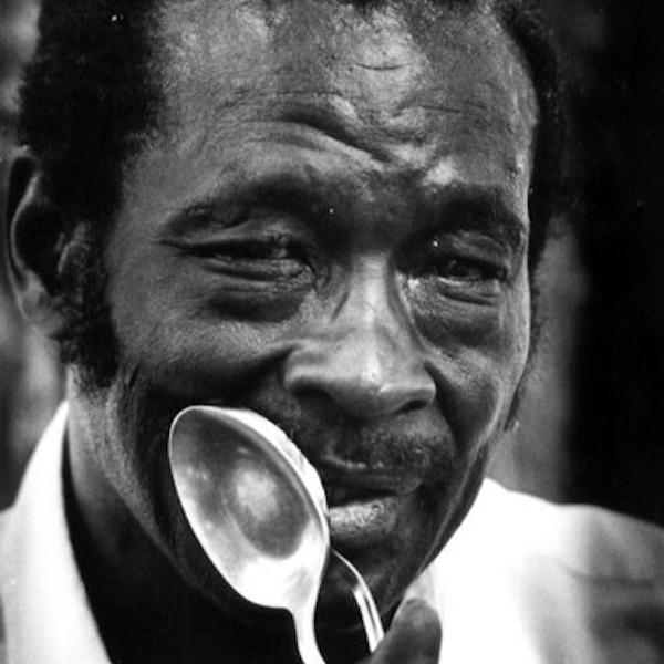 A man holding a large spoon.