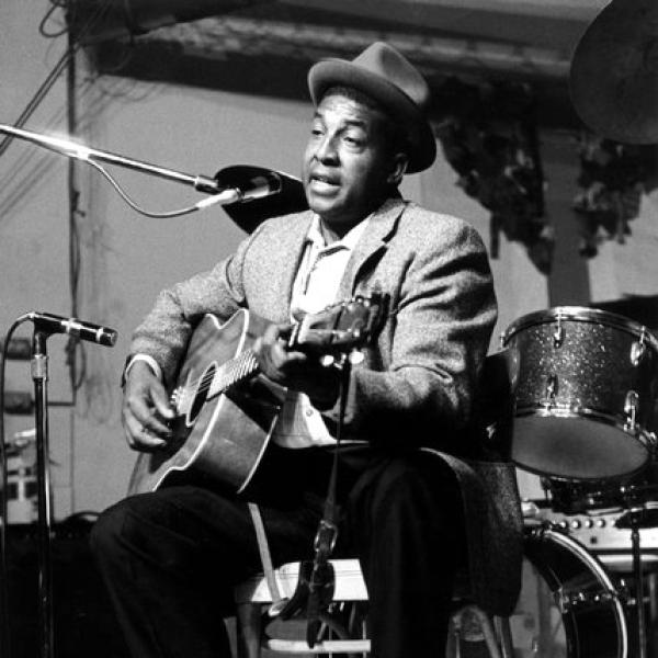 A man playing a guitar.