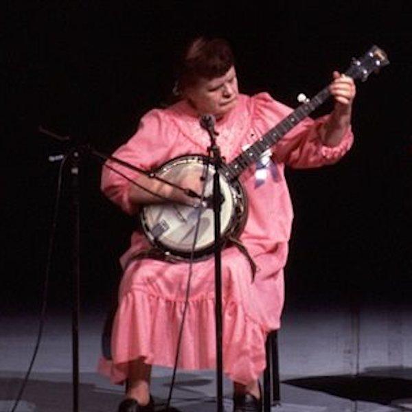 A woman playing a banjo.