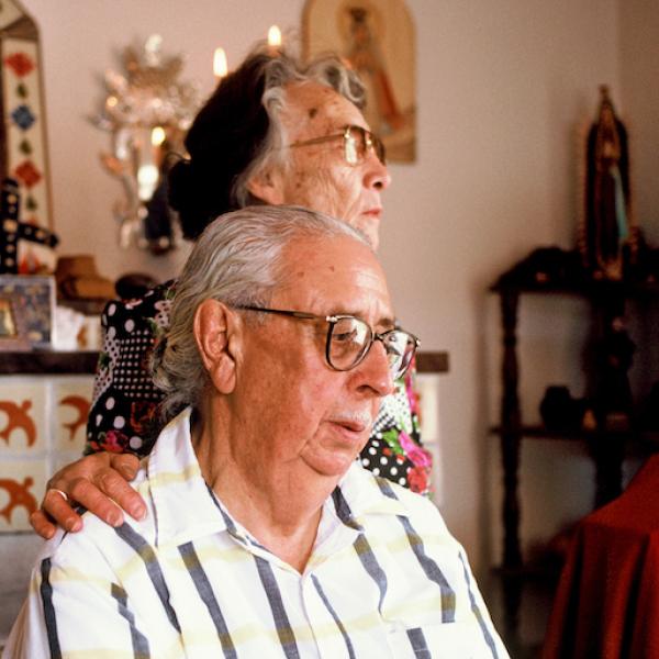 A man and a woman looking away from the camera.